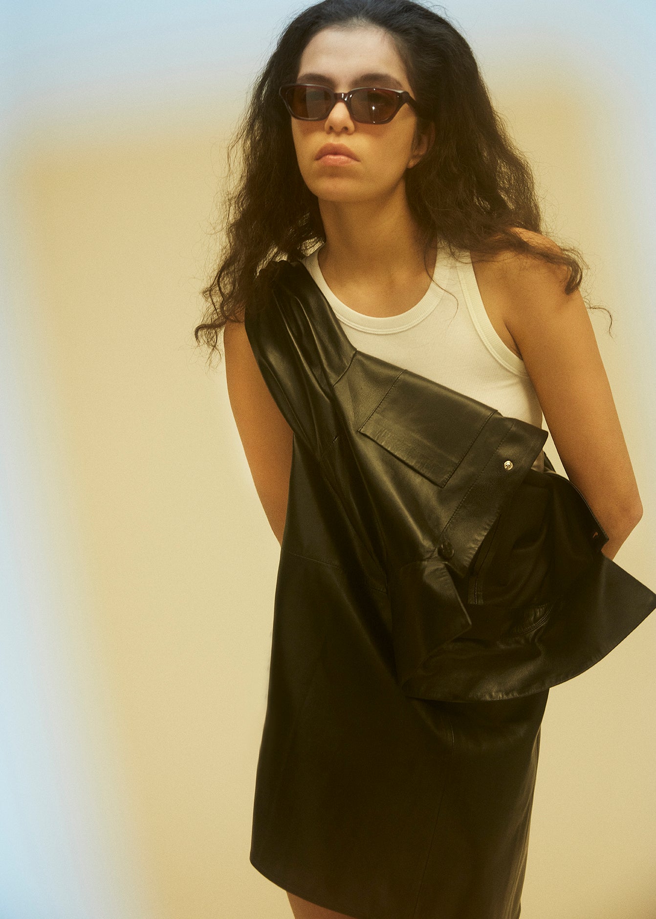 12544 SAUL - UTZON AW24 Leather shirt tied around shoulder and waist hands tucked back