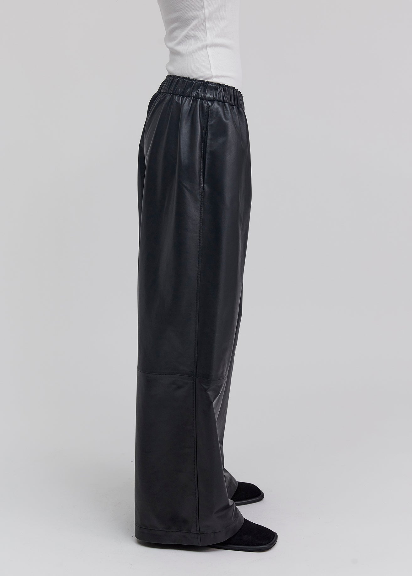 13543 PABLO UTZON aw24 black lamb leather pants styled with a white tanktop side