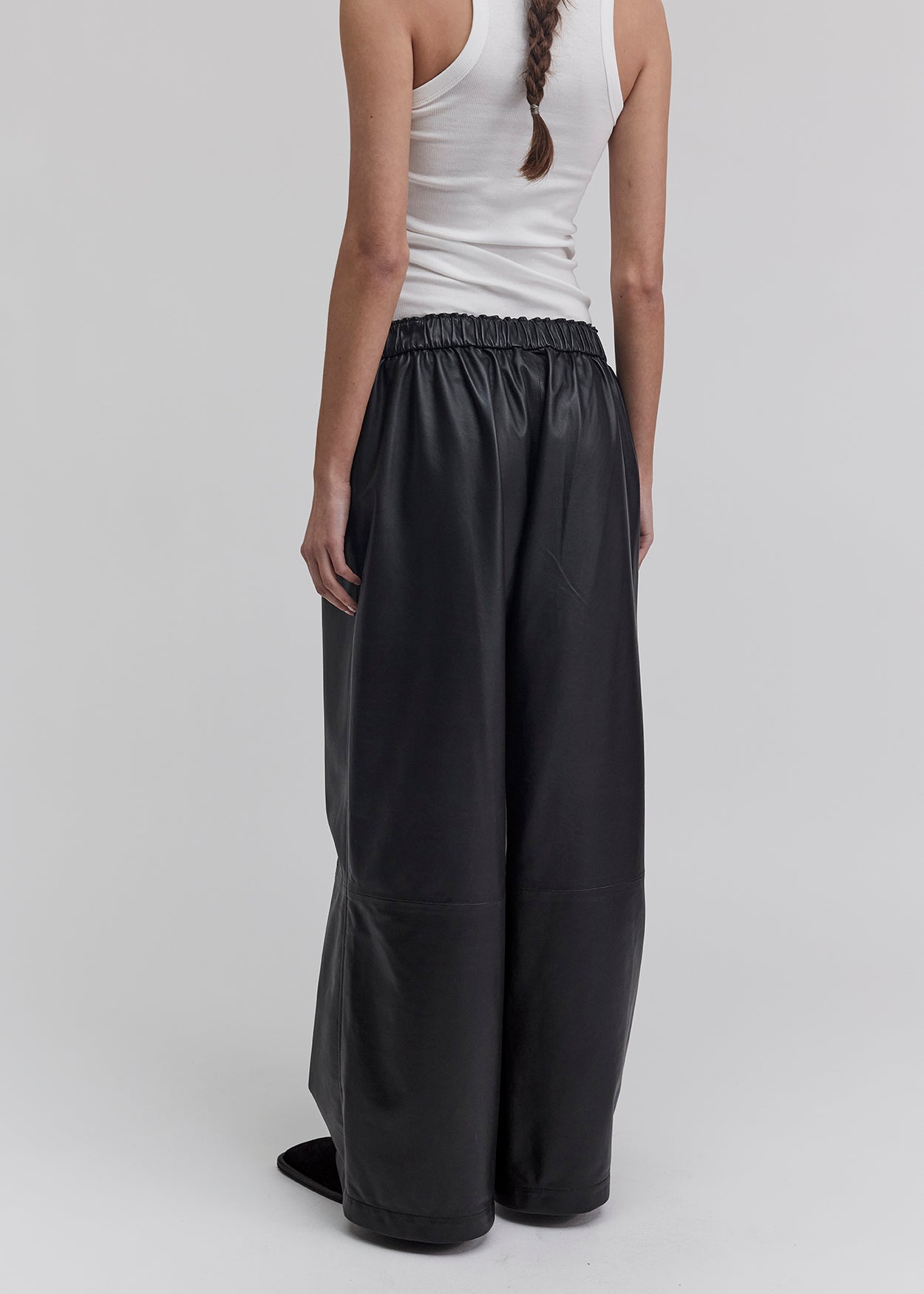 13543 PABLO UTZON aw24 black lamb leather pants styled with a white tanktop and sunglasses back