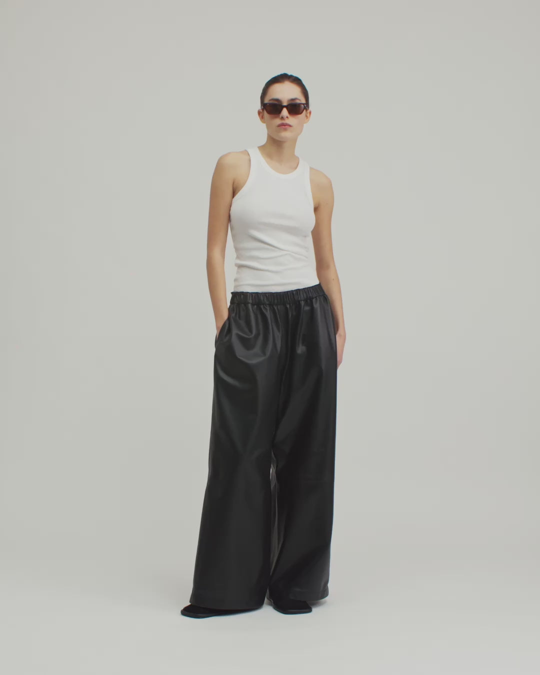 13543 PABLO UTZON aw24 black lamb leather pants styled with a white tanktop and sunglasses 360
