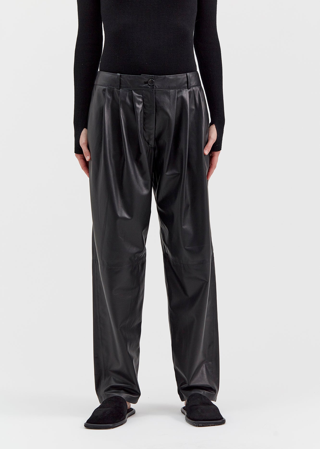 13542 PETER UTZON aw24 black lamb leather pants styled with a black top and black slippers close up of legs front