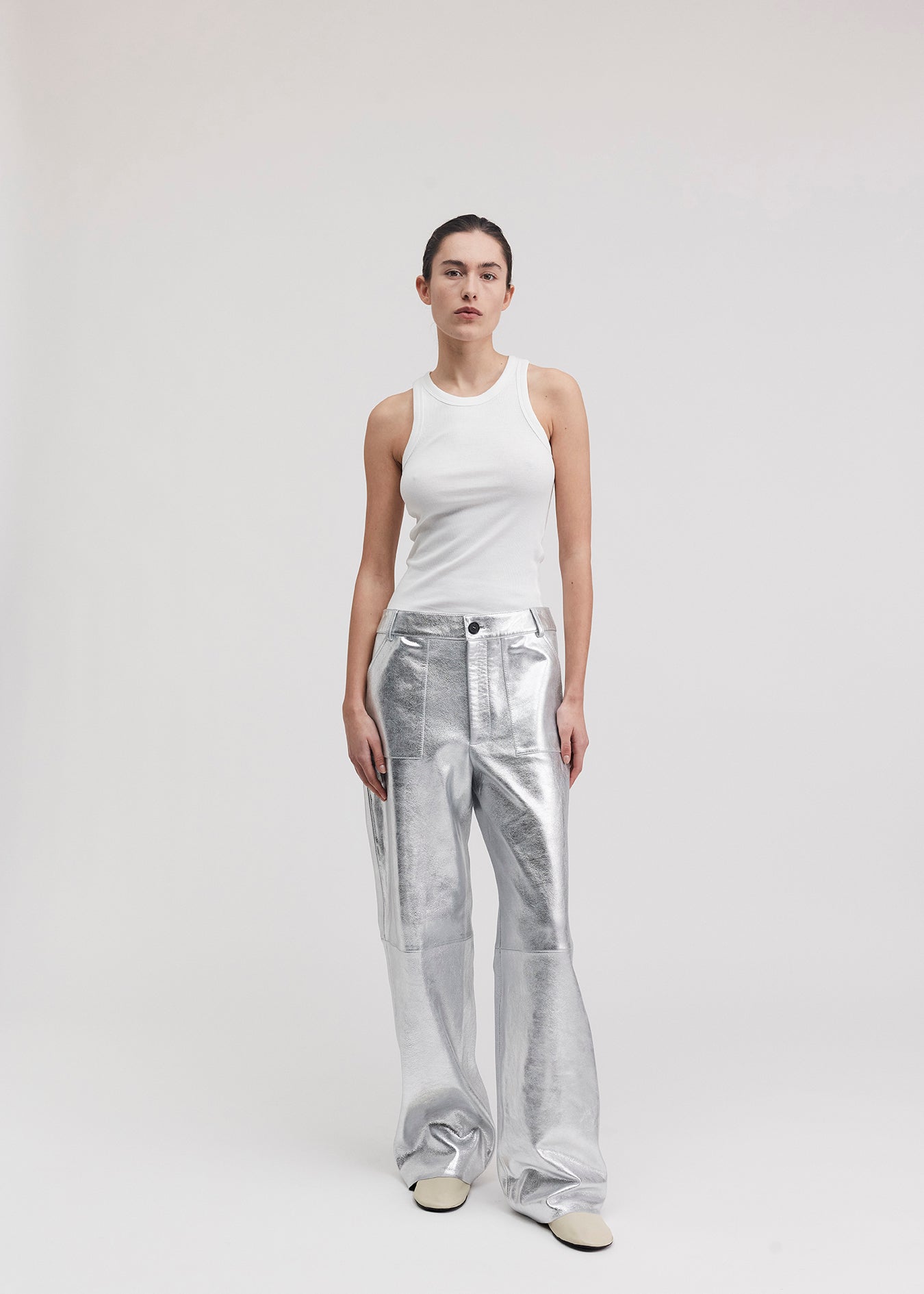 13528 BLANCE UTZON aw24 silver leather pants styled with a white tanktop front
